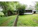 Expansive backyard with a fenced perimeter and a screened-in porch, offering privacy and comfort at 1395 Clay Sw Rd, Mableton, GA 30126