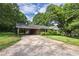 A single-story brick house with a well-manicured lawn and a covered carport at 1395 Clay Sw Rd, Mableton, GA 30126