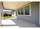 Covered back patio perfect for outdoor relaxation with a view of the backyard at 2856 Knob Creek Dr, Snellville, GA 30078
