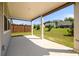 Covered back porch with a view of the grassy yard, perfect for relaxing or entertaining at 2856 Knob Creek Dr, Snellville, GA 30078