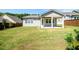 The backyard has a covered patio and a large grassy area, perfect for outdoor activities and relaxation at 2856 Knob Creek Dr, Snellville, GA 30078