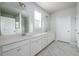 Spacious bathroom with dual sinks, white cabinets and modern lighting at 2856 Knob Creek Dr, Snellville, GA 30078