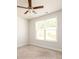 Cozy bedroom featuring a ceiling fan and large window at 2856 Knob Creek Dr, Snellville, GA 30078