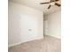 Bedroom with plush carpet, a closet, ceiling fan, and a window for natural light at 2856 Knob Creek Dr, Snellville, GA 30078