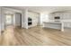 Spacious kitchen featuring white cabinets, modern appliances, and an island, flowing into the living area at 2856 Knob Creek Dr, Snellville, GA 30078