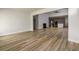 Spacious living room offers wood-look floors, fireplace, and an open floorplan to the kitchen at 2856 Knob Creek Dr, Snellville, GA 30078