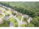 Aerial view of the neighborhood showcases mature trees, well-manicured lawns, and lovely homes at 3932 E Saddle Ridge Dr, Lithonia, GA 30038