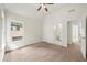 Inviting bedroom with neutral carpet, ceiling fan, and ensuite bathroom and walk-in closet at 3932 E Saddle Ridge Dr, Lithonia, GA 30038