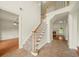 Grand foyer with staircase leading to the second floor, tile floors, and high ceilings at 3932 E Saddle Ridge Dr, Lithonia, GA 30038