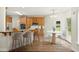 Eat-in kitchen features stainless appliances, tile floors, and a breakfast bar at 3932 E Saddle Ridge Dr, Lithonia, GA 30038