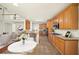 Open kitchen with barstool seating, tile floors, and stainless steel appliances at 3932 E Saddle Ridge Dr, Lithonia, GA 30038