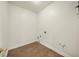 Utility room with tile floor, white walls, and hookups for washer and dryer at 3932 E Saddle Ridge Dr, Lithonia, GA 30038