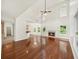 Open concept living room with fireplace, hardwood floors, and natural light at 3932 E Saddle Ridge Dr, Lithonia, GA 30038