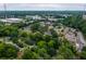 Eye-level shot showing community, residences, lush green treetops, and urban landscape from above at 178 Wesley Ne Ave # A, Atlanta, GA 30307