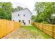 Fenced backyard with grass, perfect for outdoor activities and privacy at 178 Wesley Ne Ave # A, Atlanta, GA 30307