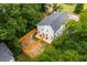 Aerial view of fenced in backyard and patio with lush green trees surrounding property at 178 Wesley Ne Ave # A, Atlanta, GA 30307