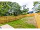 Fenced backyard with grass, perfect for outdoor activities and privacy at 178 Wesley Ne Ave # A, Atlanta, GA 30307
