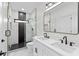 Modern bathroom featuring a double sink vanity and a sleek glass-enclosed shower at 178 Wesley Ne Ave # A, Atlanta, GA 30307