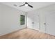 Bright bedroom with a ceiling fan, double doors, and a window with a view at 178 Wesley Ne Ave # A, Atlanta, GA 30307