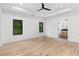 Spacious bedroom featuring hardwood floors, a tray ceiling, and ensuite bathroom at 178 Wesley Ne Ave # A, Atlanta, GA 30307