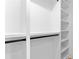 Empty closet with shelving and black metal rods for hanging clothes at 178 Wesley Ne Ave # A, Atlanta, GA 30307