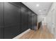 Second floor hallway with custom black paneling and hardwood floors at 178 Wesley Ne Ave # A, Atlanta, GA 30307