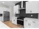 Bright kitchen with stainless steel appliances, contemporary cabinetry, and black tiled backsplash at 178 Wesley Ne Ave # A, Atlanta, GA 30307
