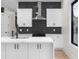 Contemporary kitchen with white cabinetry, marble countertops, and stainless steel appliances at 178 Wesley Ne Ave # A, Atlanta, GA 30307
