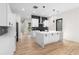 Bright kitchen with white cabinets, an island with marble countertop and hardwood floors at 178 Wesley Ne Ave # A, Atlanta, GA 30307