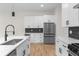 Well-lit kitchen with stainless steel appliances, large island, and contemporary cabinetry at 178 Wesley Ne Ave # A, Atlanta, GA 30307