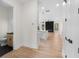 Open-concept living space showcasing modern fixtures, a sleek kitchen island, and a stylish half bath at 178 Wesley Ne Ave # A, Atlanta, GA 30307