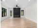 Bright living room with hardwood floors, black fireplace, and lots of natural light at 178 Wesley Ne Ave # A, Atlanta, GA 30307