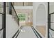 Bright foyer with marble floors, staircase with iron railings, and arched doorway at 2797 Benson Dr, Marietta, GA 30062