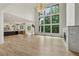 Open-concept with hardwood floors, fireplace, and a wall of windows for natural light at 2797 Benson Dr, Marietta, GA 30062