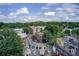 Aerial view of a mixed-use neighborhood, showcasing surrounding trees and multiple commercial buildings at 2956 Silver Hill Se Ter, Atlanta, GA 30316