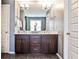 Modern bathroom featuring a double vanity with dark wood cabinets and marble countertops at 2956 Silver Hill Se Ter, Atlanta, GA 30316