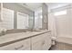 Bright bathroom featuring a shower over tub with white subway tile and modern vanity at 2956 Silver Hill Se Ter, Atlanta, GA 30316