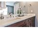Luxurious bathroom with double vanity sinks, stone countertops, and decorative mirrors at 2956 Silver Hill Se Ter, Atlanta, GA 30316