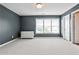A bedroom is painted with gray walls, white trim, carpeted floors and a light fixture at 2956 Silver Hill Se Ter, Atlanta, GA 30316