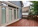 View of the deck featuring stained wood planks and white-trimmed glass doors with blinds at 2956 Silver Hill Se Ter, Atlanta, GA 30316