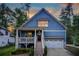 Two-story home with charming front porch, stone accents, and a two-car garage at 2956 Silver Hill Se Ter, Atlanta, GA 30316