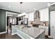 Bright kitchen with a large island and stainless steel appliances provides a view into the living room at 2956 Silver Hill Se Ter, Atlanta, GA 30316