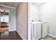 Functional laundry room with modern washer and dryer units and access to the living room at 2956 Silver Hill Se Ter, Atlanta, GA 30316