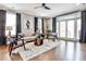 Bright living room features hardwood floors, neutral decor, and access to outdoor space at 2956 Silver Hill Se Ter, Atlanta, GA 30316