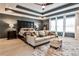 Spacious main bedroom with tray ceiling, sitting area, large bed, and lots of natural light at 2956 Silver Hill Se Ter, Atlanta, GA 30316