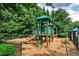 Community playground with wood chips, a slide, and other play equipment for hours of fun at 2956 Silver Hill Se Ter, Atlanta, GA 30316