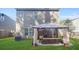 Backyard featuring a shaded gazebo and outdoor furniture for relaxing and entertaining at 3143 Bonnes Dr, Stonecrest, GA 30038