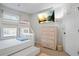 Cozy bedroom featuring a bunk bed, dresser and mounted television for comfortable living at 3143 Bonnes Dr, Stonecrest, GA 30038