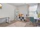 Bright home office featuring multiple desks and shelving units, perfect for remote work or study at 3143 Bonnes Dr, Stonecrest, GA 30038