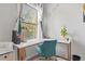 Dedicated workspace with a comfortable chair, stylish lamp, and charming decor at 3143 Bonnes Dr, Stonecrest, GA 30038